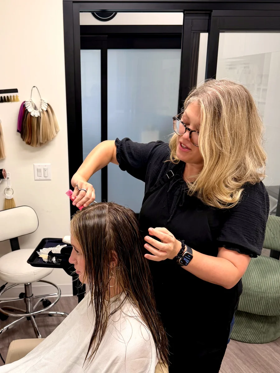 Anna Berglund sectioning a client's hair for color at her chair in Santa Monica.