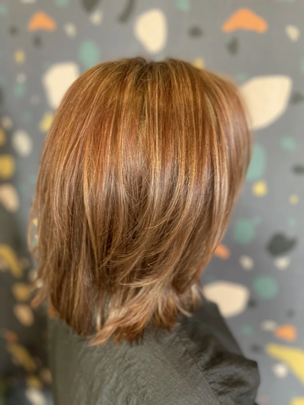 Hair color after the first color correction appointment, a deeper, more even copper tone.