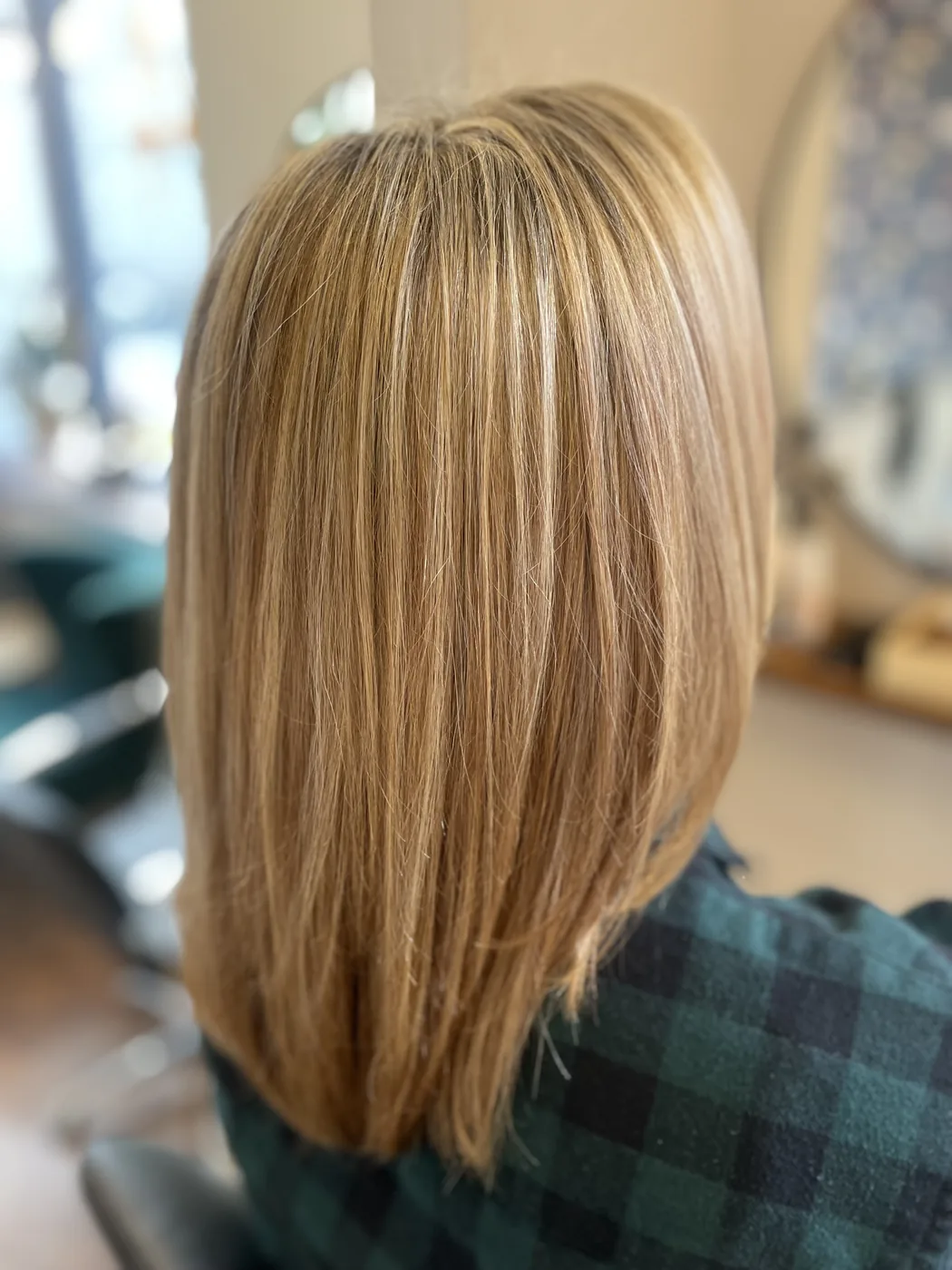 Hair color after the third color correction appointment, a more neutral golden blonde.